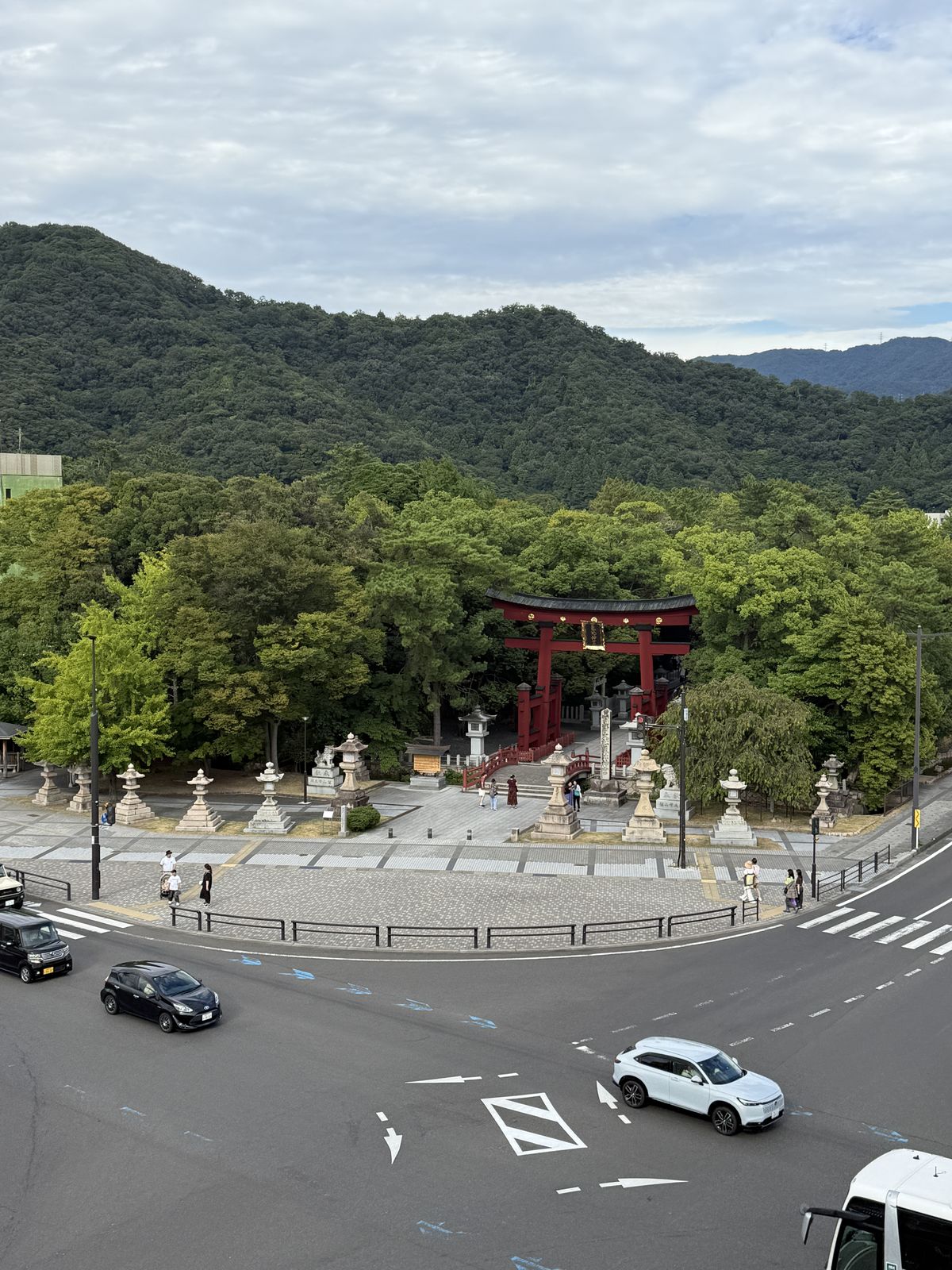 Kehi Jingu, the mountains behind the town, and the road in front of it