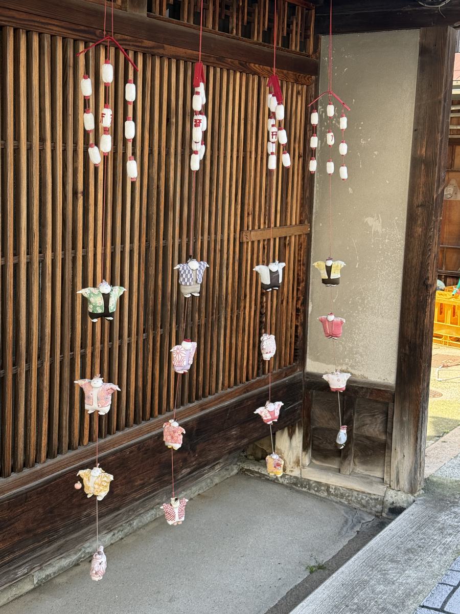 Hanging decorations outside a wooden house